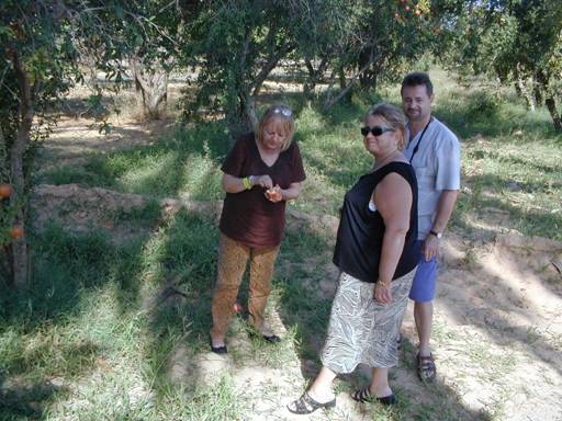 us testing out some pomegranates along the road to Gabes.